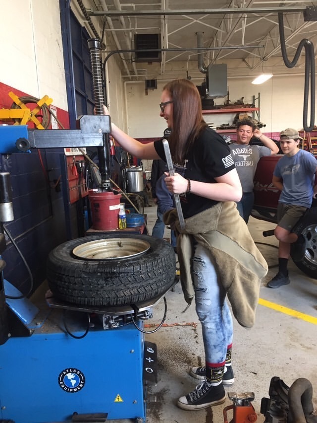 Shea Downs Lines Up a Tire on the Machine