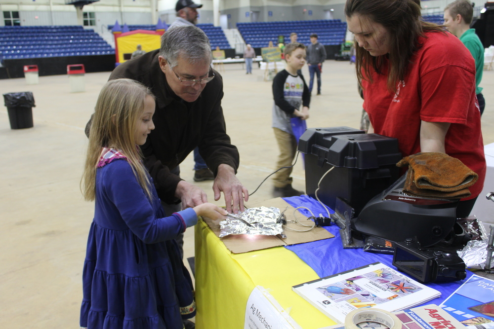 Mr. Deaton and Trinity Davis Model an Arc Plasma Method at the FFA Informational Booth