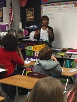 Demetria Wallace speaking with Biggersville Eighth Grade Students