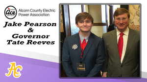 Pearson poses with Governor Reeves at the Electric Cooperative Youth Leadership Program