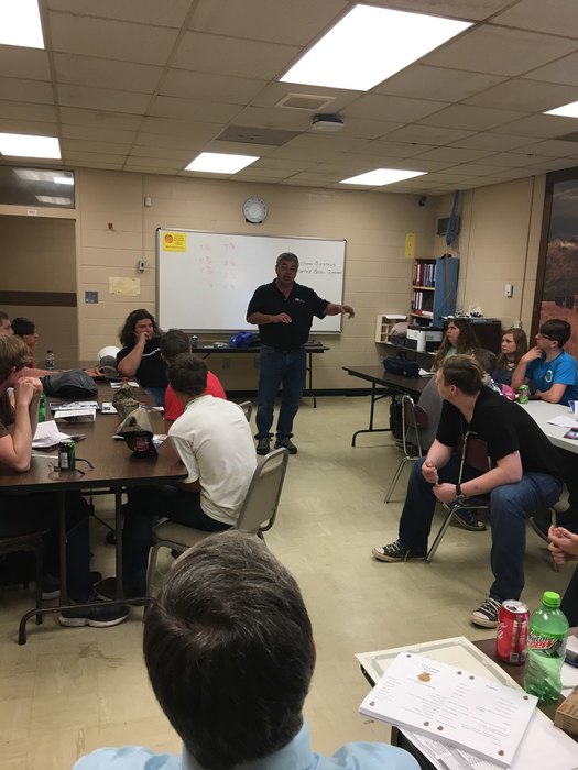 Gene Ivey with Ingalls Shipbuilding speaking with students about career opportunities.
